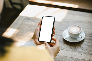 cell phone blank white screen mockup.woman hand holding texting using mobile on desk at office.background empty space for advertise.work people contact marketing business,technology