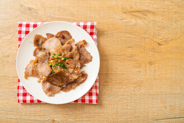 grilled pork neck sliced on plate