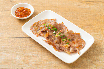 grilled pork neck sliced on plate