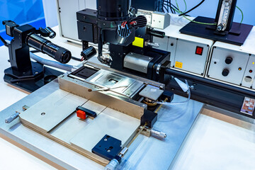 Flexible submicron mounting station. Equipment for production of microchips. Close-up of submicron editing station. Device for manufacture of microchips. PCB production machine. Microchip production