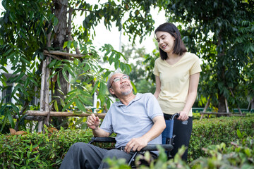 Naklejka na ściany i meble Asian happy Senior retired grandfather enjoy outdoor at green park. 