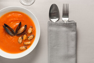 Bowl of tasty Cacciucco soup on table, closeup
