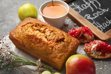 Bread with honey and fruits on grunge background. Rosh hashanah (Jewish New Year) celebration