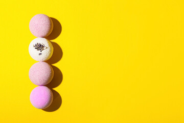 Lavender bath bombs on color background