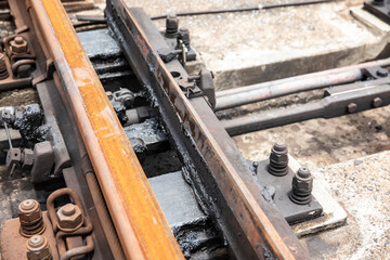 close up rail tracks with  grease make it flow smoothly