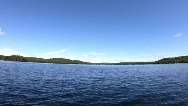 Point of view video footage of a boat on a lake. Twelve Mile Lake, Ontario, Canada.