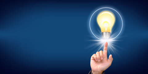 Idea innovation and inspiration concept. businessman holding illuminated light bulb
