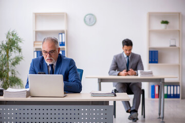 Two male colleagues working in the office
