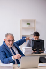 Two male colleagues working in the office