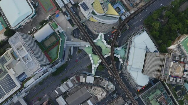 Aerial view of Siam Bangkok Art and Skywalk aerial view in MBK Culture Center intersection or junction with cars traffic skyscraper buildings. Bangkok City in downtown at night, Thailand