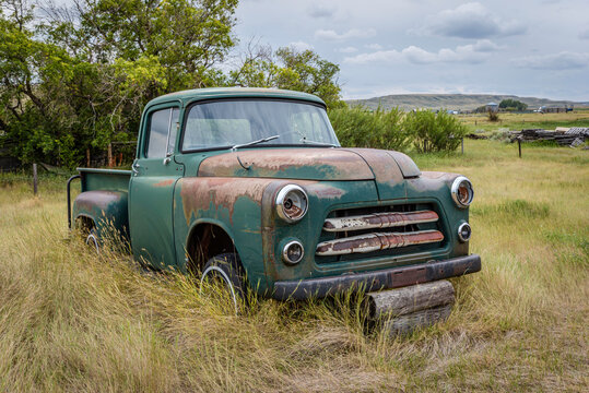 Abandoned vintage green pick up truck on the Saskatchewan prairies