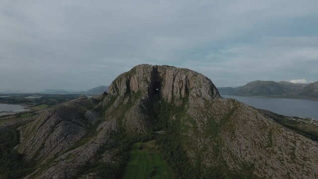 Aerial View Of The Mountain Torghatten In Br&oslash;nn&oslash;ysund, Northern Norway - drone pullback
