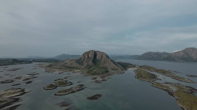Torghatten Mountain On Torget Island Outside Of Br&oslash;nn&oslash;ysund On The West Coast of Norway, Helgeland Coast - aerial pullback