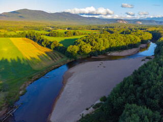 aerial view of mountain valley and river in the morning light