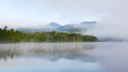 landscape of morning lake in the fog