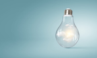 Light bulb on light blue background