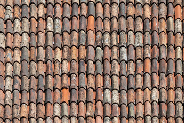old antique roof tiles at the roof of an old house - obrazy, fototapety, plakaty