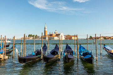 Venice with gondolas on Grand Canal against San Giorgio Maggiore church