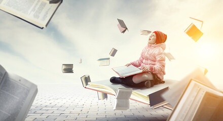 Little girl reading a book