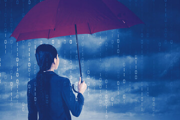 Businesswoman holding an umbrella in cyberspace