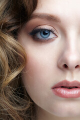 Closeup macro shot of blue human female eye. Woman with natural face beauty makeup.