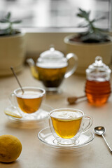 tea drinking in transparent glass dishes