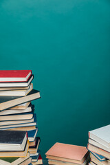 stacks of books for teaching knowledge of the university library green background