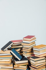 Stacks of books for teaching knowledge of the college school library white background