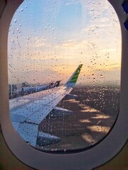 The rest of the raindrops on the plane window pane.