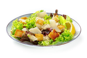 Chicken Caesar salad, isolated on a white background. Romaine leaves, crispy croutons and chicken fillet meat