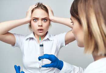 female doctor syringe in hand treatment isolated background