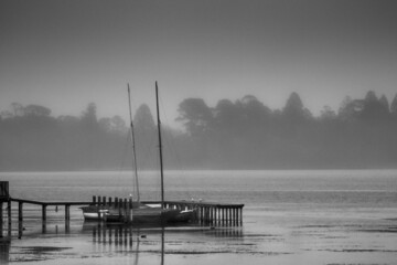 Sail boats moored at Lake Wendouree jetty on a cold misty morning