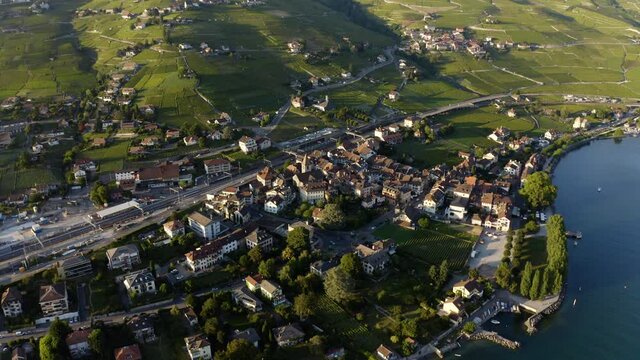 Cully Village On FoothillOf Green Lavaux vineyard At Dusk, Switzerland. - aerial