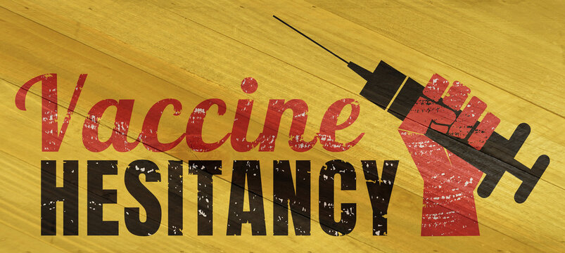 Vaccine hesitancy sign on wood grain texture