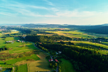 Mountain village and agricultural fields, aerial view. Nature landscape