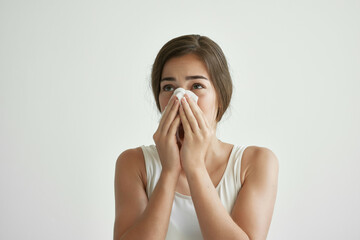 woman with runny nose flu health problems