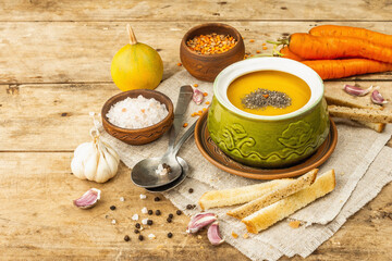 Vegetable cream soup. Traditional autumn hot food, croutons, and spices