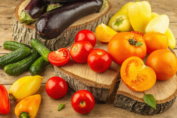 Assortment of fresh vegetables on a wooden background