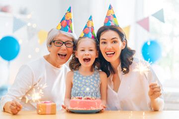 Grandmother, mother and daughter are celebrating birthday