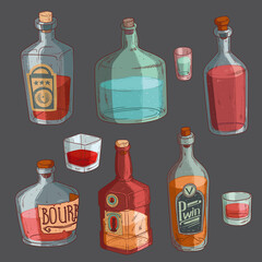 Isolated bottles and glasses filled with alcohol