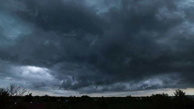 Time lapse, dark storm clouds with background,Dark clouds before a thunder-storm.
