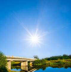 small bridge over the river under a sparkle sun