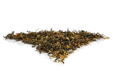 Dry black tea leaves in triangle shape isolated on white background