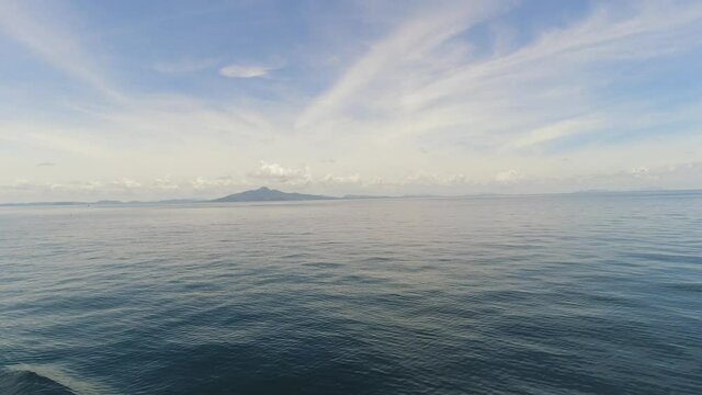 The Island of Koh Phi Phi on the Horizon from a Ferry Boat Leaving Krabi, Thailand.