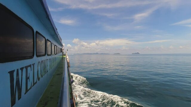 Ferry Crossing The Open Waters with Beautiful Blue Skies Heading to Koh Phi Phi Islands from Krabi in Thailand.