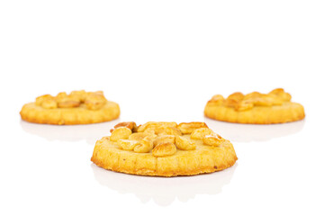 Group of three whole delicious cookie with peanuts one is in the front on white background