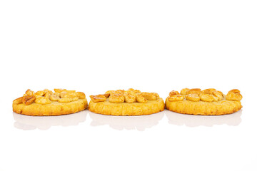 Group of three whole delicious cookie with peanuts in row on white background