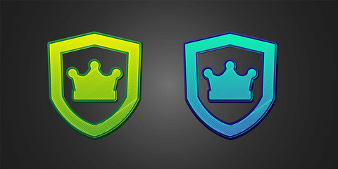 Green and blue Shield with crown icon isolated on black background. Vector