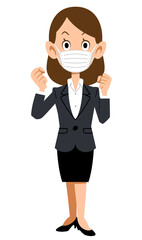 ガッツポーズするマスクを付けてスーツを着た女性
