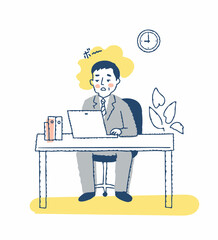 デスクワーク中にぼんやりしているビジネスマン